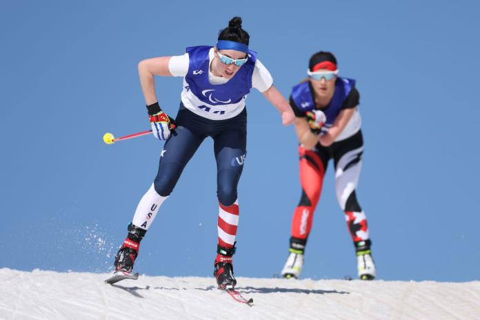 Two female skiers competing in cross-country skiing